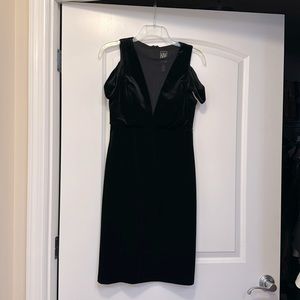 Short black velvet dress.